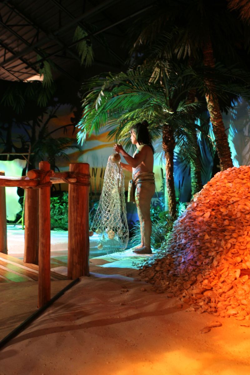 A Calusa fisherman about to cast his net.